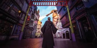 Diagon Alley girl in robe at diagon alley