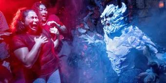 Halloween Horror Nights 2024 Two women screaming as someone dressed as a snow covered yeti jumps out at them in a haunted house