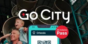 Go City: Orlando All-Inclusive Pass Picture of man with his son on his shoulders, the child with his arms out stretched as they walk past a large rocket on display. There is an image of a phone with a QR code on it to show the digital ticket.