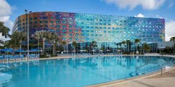 Exterior of Stella Nova and large pool. The outside is full of multi-coloured mosaic tiles of different colours.