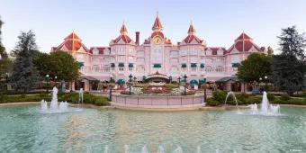 Looking over a large fountain towards the exterior of the Disneyland Hotel 