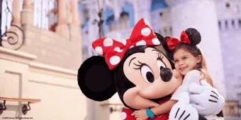 Disney bands at Walt Disney World Resort A young girl hugging Minnie Mouse in front of Cinderella Castle at Walt Disney World