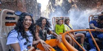 Kali River Rapids A group of friends getting splashed on a river raft ride