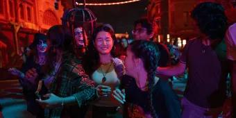 A group of friends being scared at a Halloween event