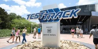 The white sign with blue text in capital letters saying "TEST TRACK".