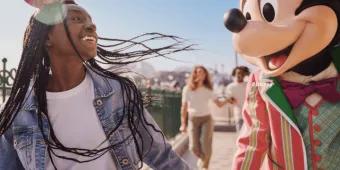 Guest with Mickey Mouse at Disney Adventure World