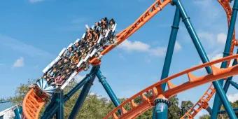Ice Breaker's orange track twisting through steep drops and turns at SeaWorld Orlando