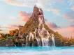 Universal Volcano Bay Water Park A large volcano spilling water into a water park wave pool