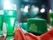 St Patrick's Day in Orlando A glass full of green liquid next to a green hat with a shamrock and an Irish flag