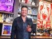 Blake Shelton at Ole Red Blake Shelton holding a glass of sangria behind a bar