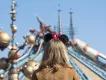 Discoveryland in Disneyland Paris A girl wearing Minnie ears standing with her back to the camera, looking at Hyperspace Mountain
