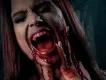 Fright Nights at Thorpe Park A woman screaming and holding her face with blood on her hands and chin