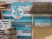 Island H2O Live A photo backdrop of weathered shiplap boards, wooden crates and a beach hut