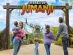 World of Jumanji A family standing in front of a sign reading World of Jumanji. One child is holding her face as if in shock