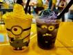 Minions Cafe at Universal Studios Florida Two cups with faces designed to look like Minions, one filled with a yellow drink and one filled with a purple drink