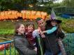 Brick or Treat at LEGOLAND Windsor A family posing in front of a sign reading "Brick or Treat". The two children are dressed in Halloween costumes