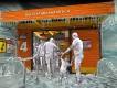 Penguin Trek Concept Art Artists impression of people queuing for Penguin Trek going into an orange sea station covered in ice