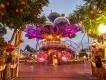 Halloween at PortAventura A large cartoon style tree decorated with sparkling lights and pumpkins