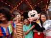 Walt Disney World Resort in Florida Mickey Mouse hugging and posing with 4 young adults