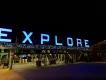 Holidays in Space at Kennedy Space Center An entrance gate decorated with Christmas decorations and "EXPLORE" lit up with blue lights