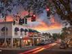 Mount Dora at night A street of shops and restaurants with the sun setting in the distance