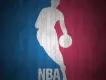 NBA logo NBA logo with white outline of man dribbling a basketball with a red and blue wooden background.