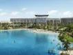 Orlando’s Evermore Resort Large modern building which is rectangular stood behind a beautiful beach with sand and a huge pool shaped like the sea shore. There are people paddle boarding, kayaking and sitting on large inflatable flamingos.