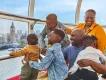 Visiting London with Kids A family looking at Big Ben and the Thames from the London Eye
