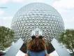 EPCOT at Walt Disney World Resort A young girl wearing Minnie ears facing towards Spaceship Earth at EPCOT