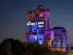 The Twilight Zone Tower of Terror A large creepy looking tower standing tall above trees which looks like a run down, creepy hotel with a sign lit saying the Hollywood Tower Hotel.