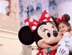 Disney bands at Walt Disney World Resort A young girl hugging Minnie Mouse in front of Cinderella Castle at Walt Disney World