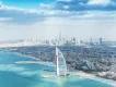 Dubai Skyline The Burj Al Arab on an island out at sea shaped like a boat sail and in the background you can see the whole city skyline.