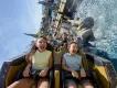 Hiccup's Wing Gliders at Universal Epic Universe Two kids riding a rollercoaster over water
