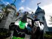 LEGOLAND’S Brick-or-Treat A lego green witch and a lego vampire at the gates of a castle.