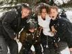 A happy family playing in the snow during a winter holiday