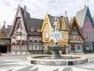 Arendelle-style buildings surround a crystalline snowflake fountain at Disneyland® Paris