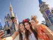 Three guests taking a selfie outside Cinderella Castle
