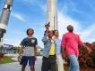 A family walking past large rockets at the Kennedy Space Center Rocket Garden