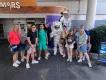 Group taking photo with an astronaut