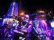 Two costumed Fortnite characters posing in front of an illuminated Halloween Horror Nights sign at Universal Studios