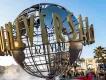 The iconic Universal Studios revolving globe monument at the theme park's entrance plaza