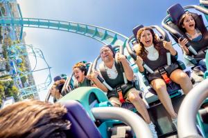 Riders screaming as they ride the Emperor coaster