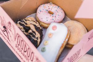 A box of iced ring and filled doughnuts from Voodoo Doughnuts
