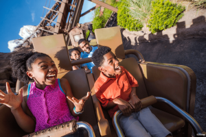 Two children smiling while riding Expedition Everest