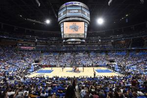 A crowded stadium watching an Orlando Magic basketball game