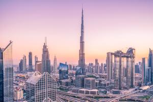Long distance view of the Burj Khalifa and other buildings during sunset