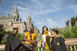 A family posing outside Hogwarts Castle in Universal Orlando Resort