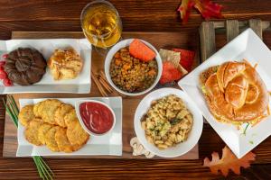 A bird's eye view of a table full of autumnal food dishes