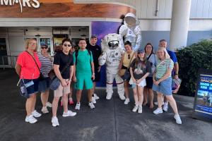 Group taking photo with an astronaut