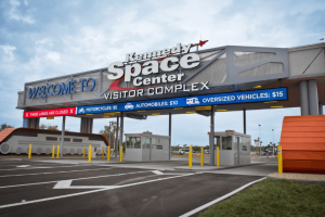 The parking toll booths and welcome sign at the entrance to the Kennedy Space Center Visitor Complex